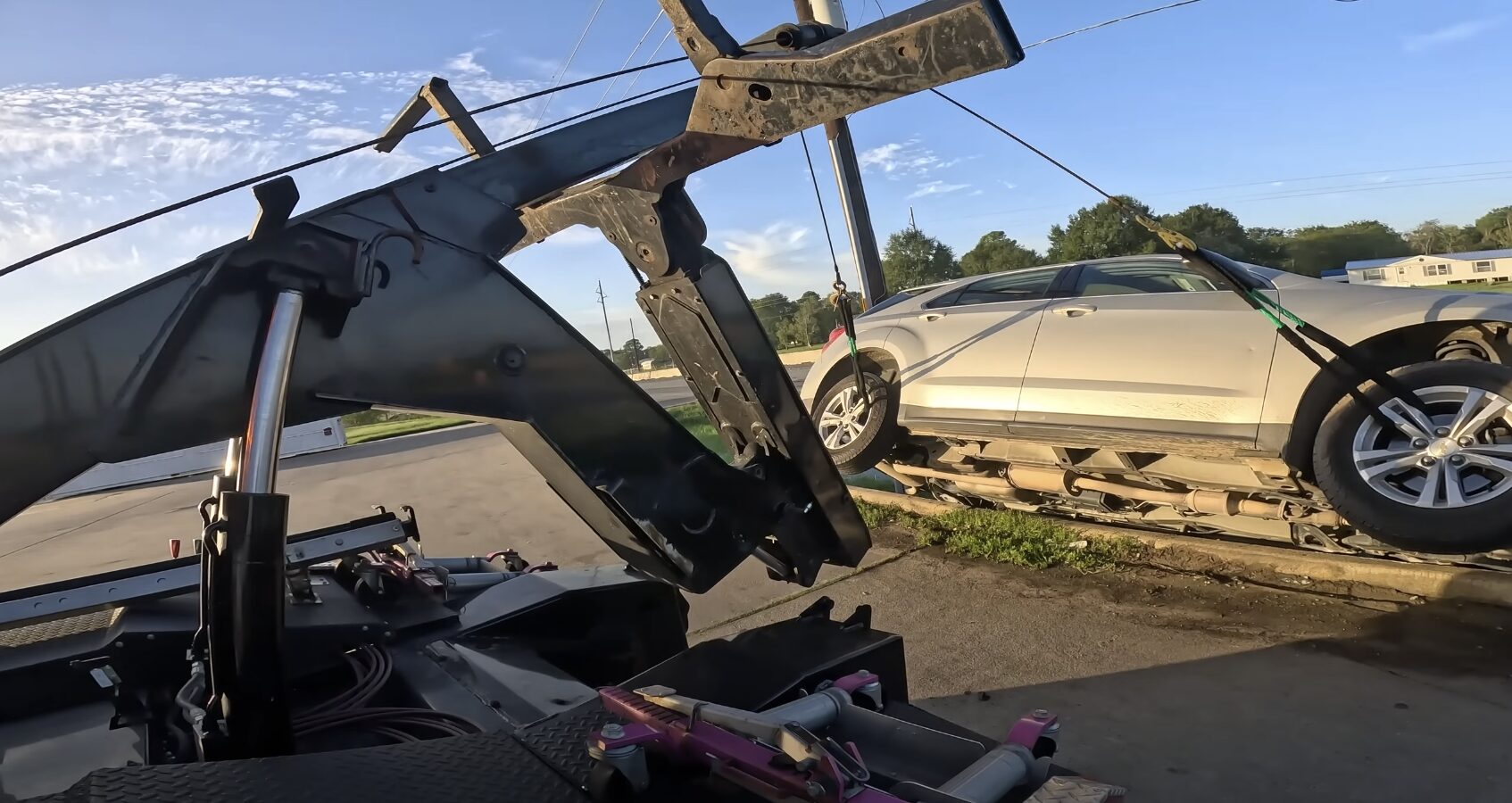 Emergency Towing Service in Action Professional towing service operator loading a vehicle onto a flatbed truck in Babylon, NY