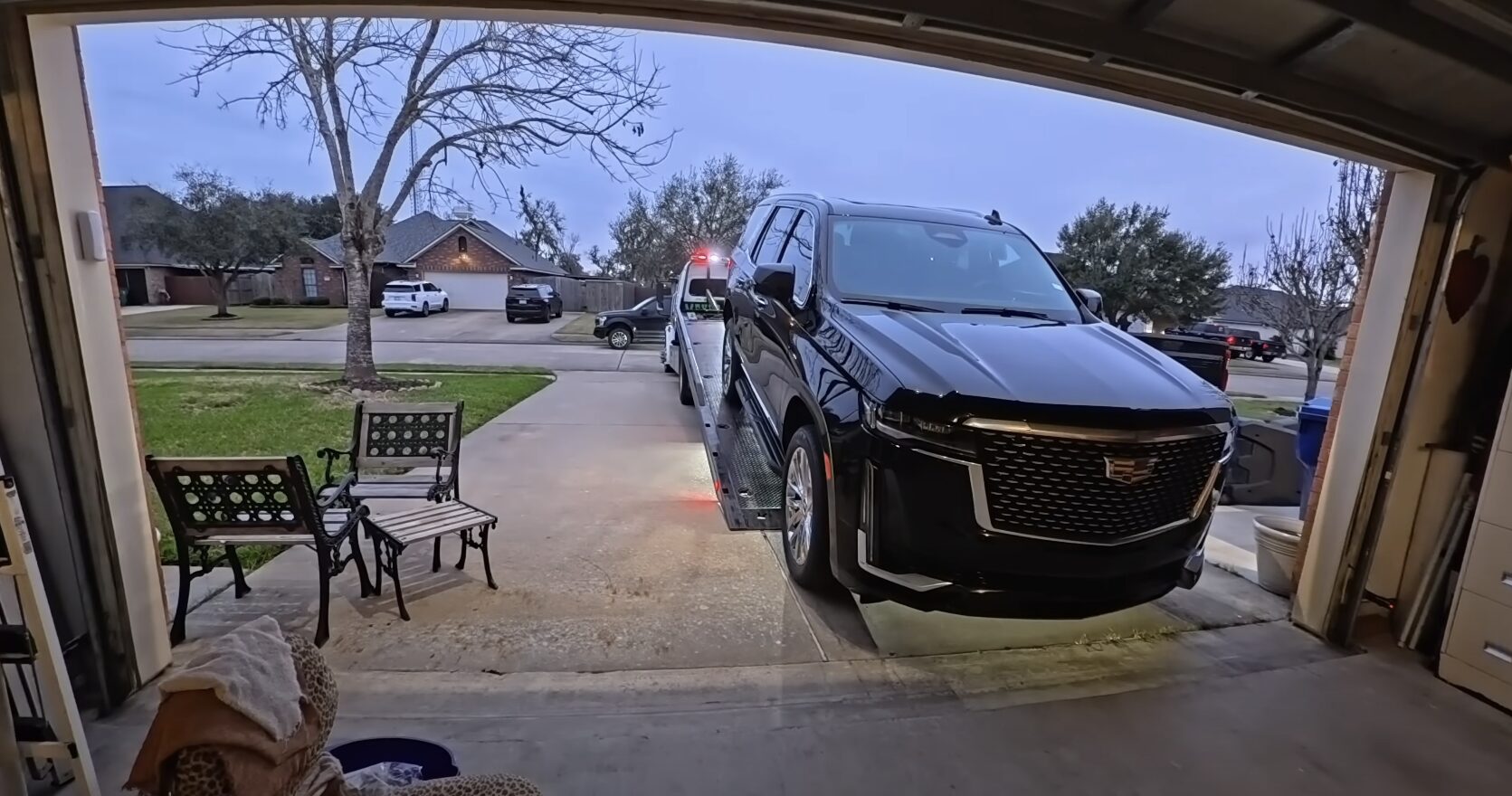 Professional Vehicle Loading and Protection Professional towing service loading a vehicle safely onto a flatbed truck in Babylon, NY